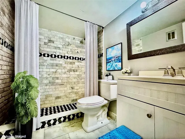 a bathroom with a toilet and a sink