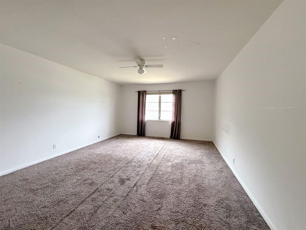 12 Northeast 19th Court, Unit 204A Wilton Manors, FL 33305 - Photo 5 of 21 a view of empty room with window