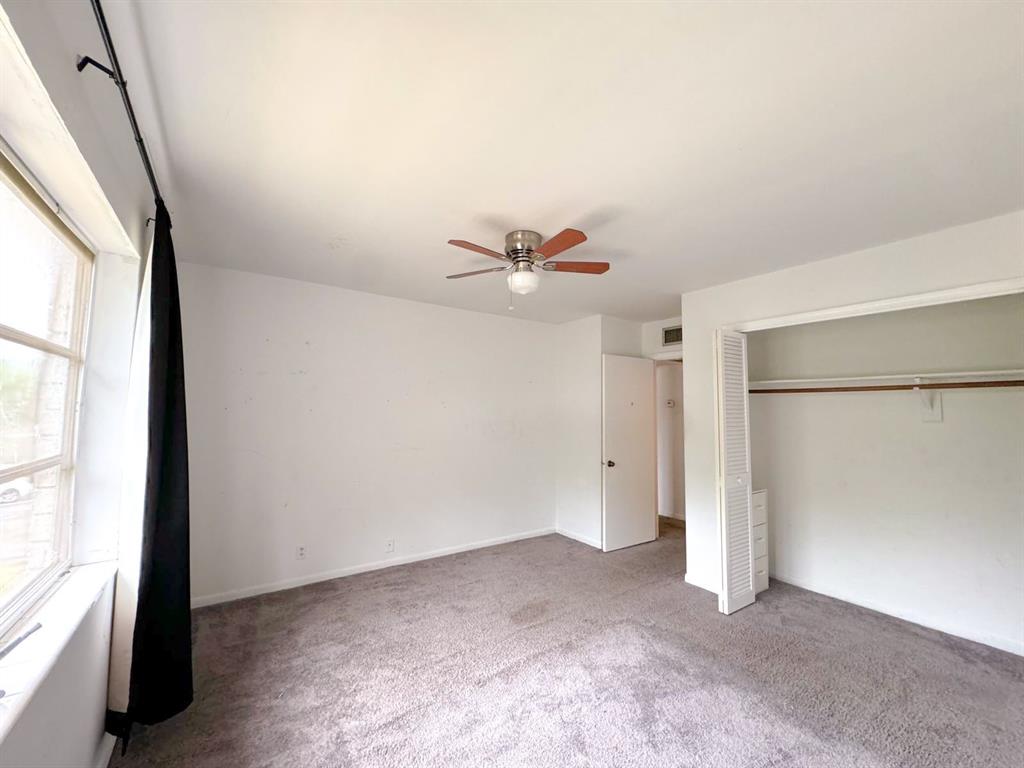 12 Northeast 19th Court, Unit 204A Wilton Manors, FL 33305 - Photo 9 of 21 a view of an empty room with a window