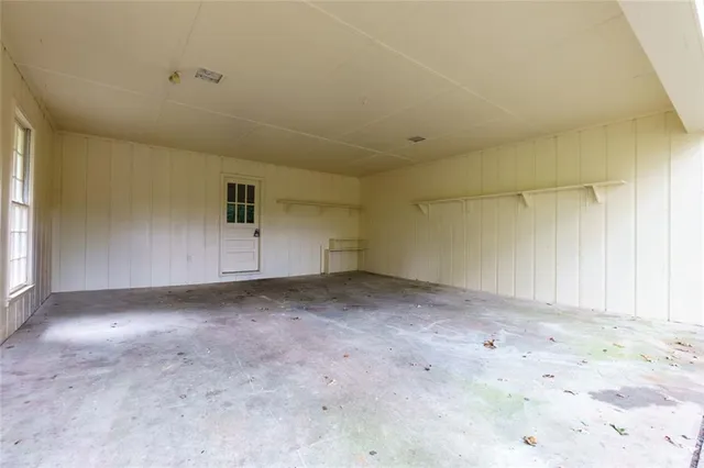 a view of swimming pool with outdoor seating and trees