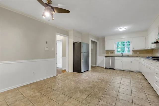 a view of a kitchen with a sink and cabinet area
