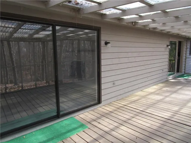 a view of a balcony with wooden floor