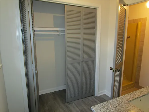 an bathroom with a granite countertop sink and a mirror