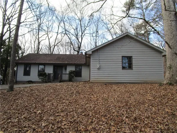 a house with trees in the background