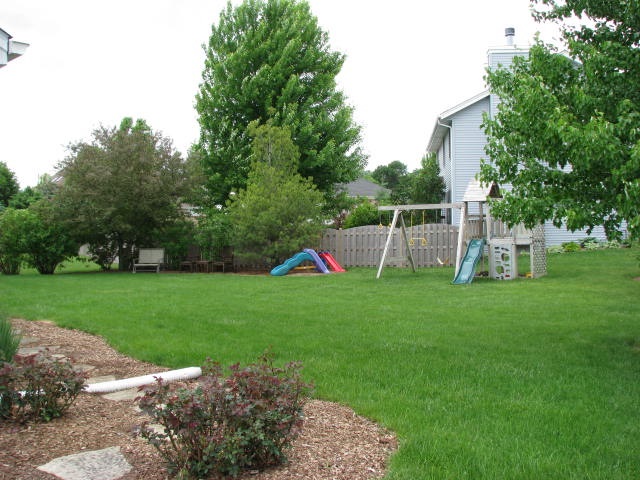 2946 Lark Rise Rockford, IL 61114 - Photo 17 of 17 a backyard of a house with lots of green space