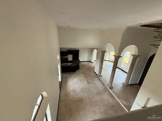 a view of living room with furniture and a fireplace