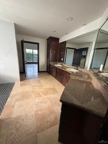 a bedroom with furniture and window