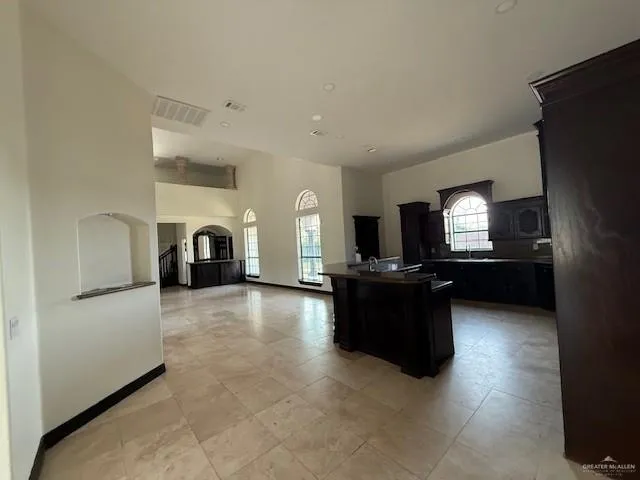 a kitchen with stainless steel appliances granite countertop a stove and a refrigerator