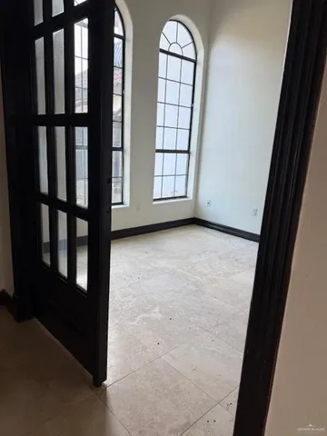 an empty room with windows