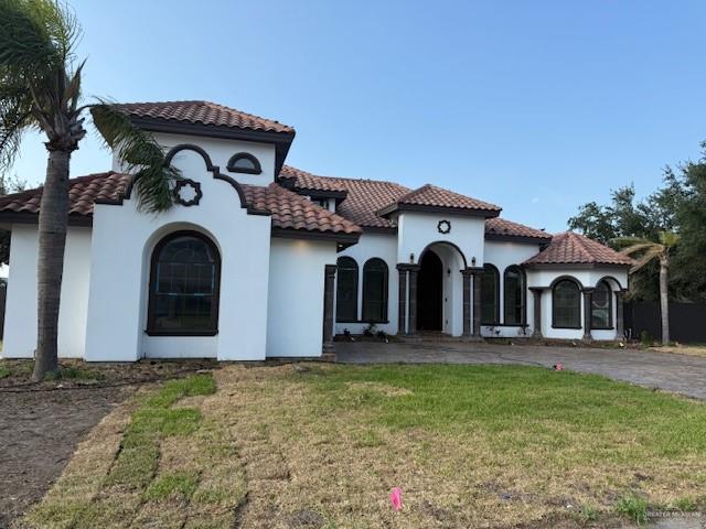 7610 Wagon Trail Drive Mission, TX 78572 - Photo 42 of 43 a front view of a house with garden