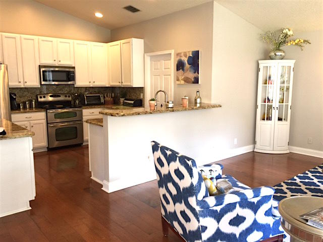 394 Mallard Point Jupiter, FL 33458 - Photo 11 of 16 a kitchen with stainless steel appliances granite countertop a sink and a refrigerator