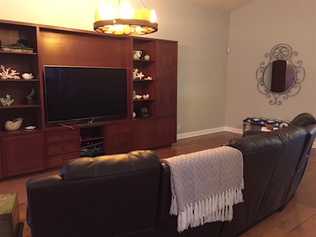 394 Mallard Point Jupiter, FL 33458 - Photo 13 of 16 a living room with furniture and a flat screen tv