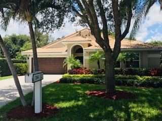 394 Mallard Point Jupiter, FL 33458 - Photo 2 of 16 a front view of a house with garden