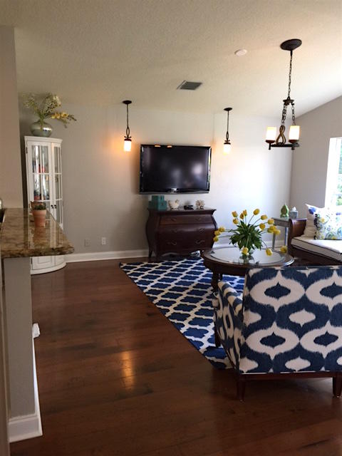 394 Mallard Point Jupiter, FL 33458 - Photo 7 of 16 a living room with furniture and a flat screen tv
