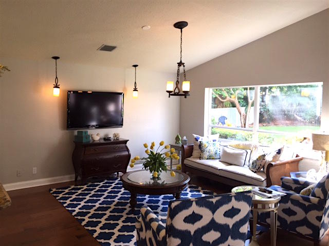 394 Mallard Point Jupiter, FL 33458 - Photo 8 of 16 a living room with furniture and a flat screen tv