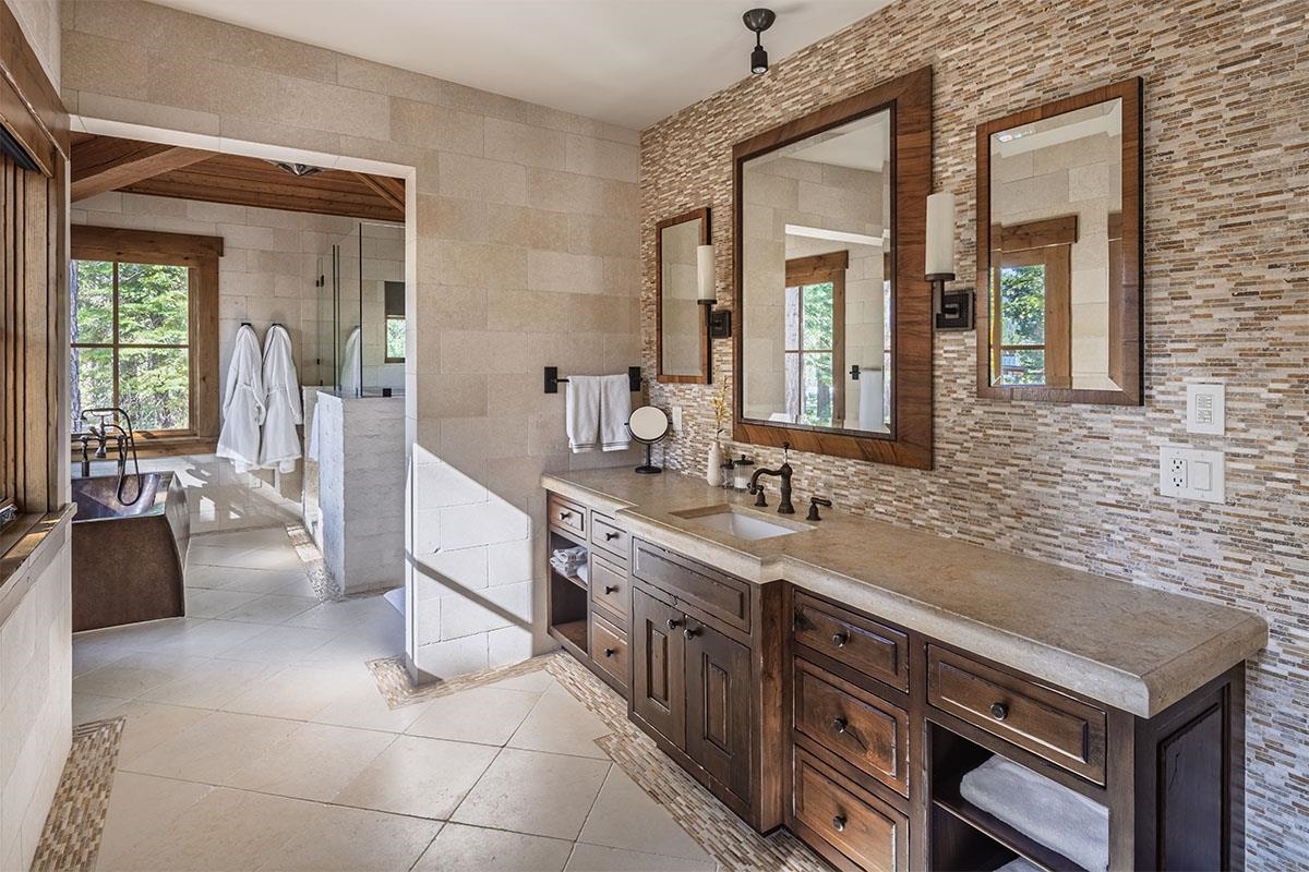8186 Valhalla Drive Truckee, CA 96161 - Photo 15 of 28 a spacious bathroom with a granite countertop sink and a mirror