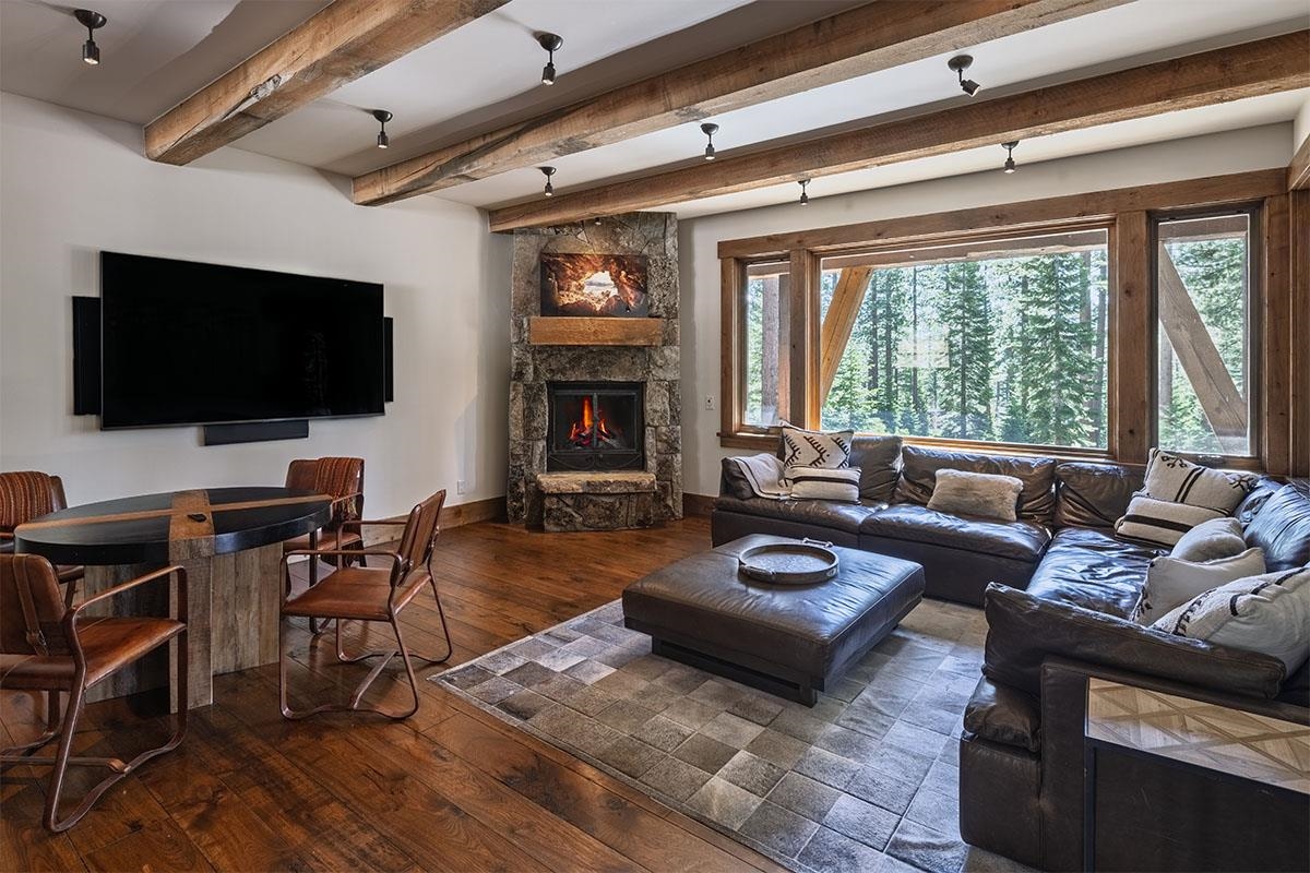 8186 Valhalla Drive Truckee, CA 96161 - Photo 24 of 28 a living room with furniture a flat screen tv and a fireplace