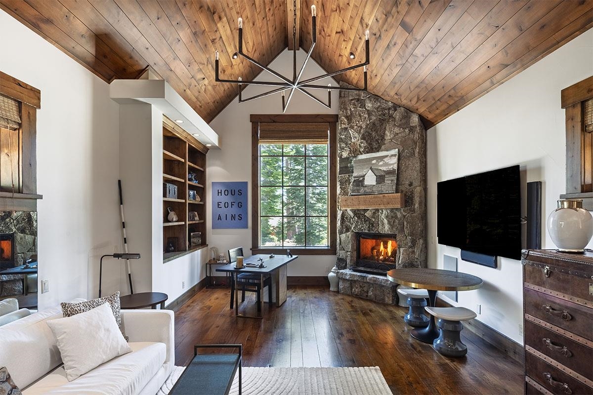 8186 Valhalla Drive Truckee, CA 96161 - Photo 28 of 28 a living room with furniture a fireplace and a flat screen tv