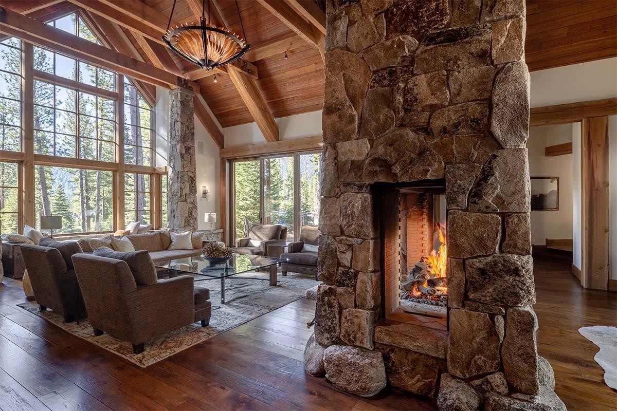 8186 Valhalla Drive Truckee, CA 96161 - Photo 7 of 28 a living room with furniture a fireplace and wooden floor