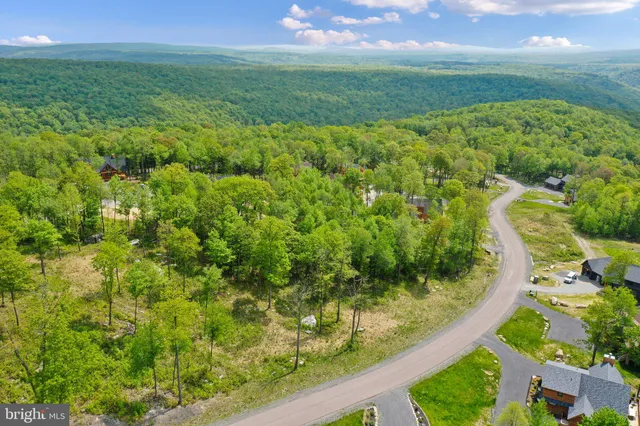 a view of a yard and an ocean view
