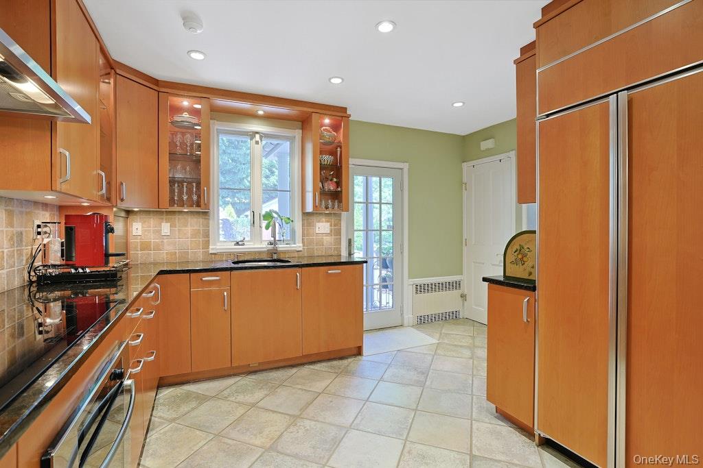 97 Underhill Road Scarsdale, NY 10583 - Photo 5 of 39 a kitchen with stainless steel appliances granite countertop a refrigerator and a stove