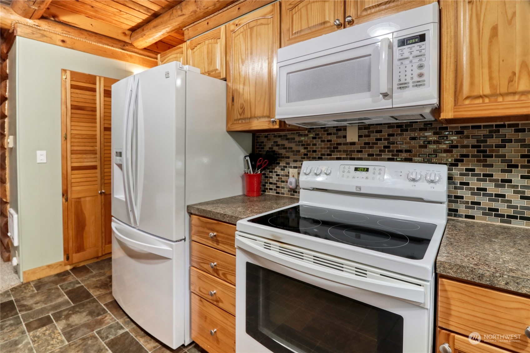18114 Rampart Drive Southeast Yelm, WA 98597 - Photo 11 of 38 a kitchen with a stove and a refrigerator