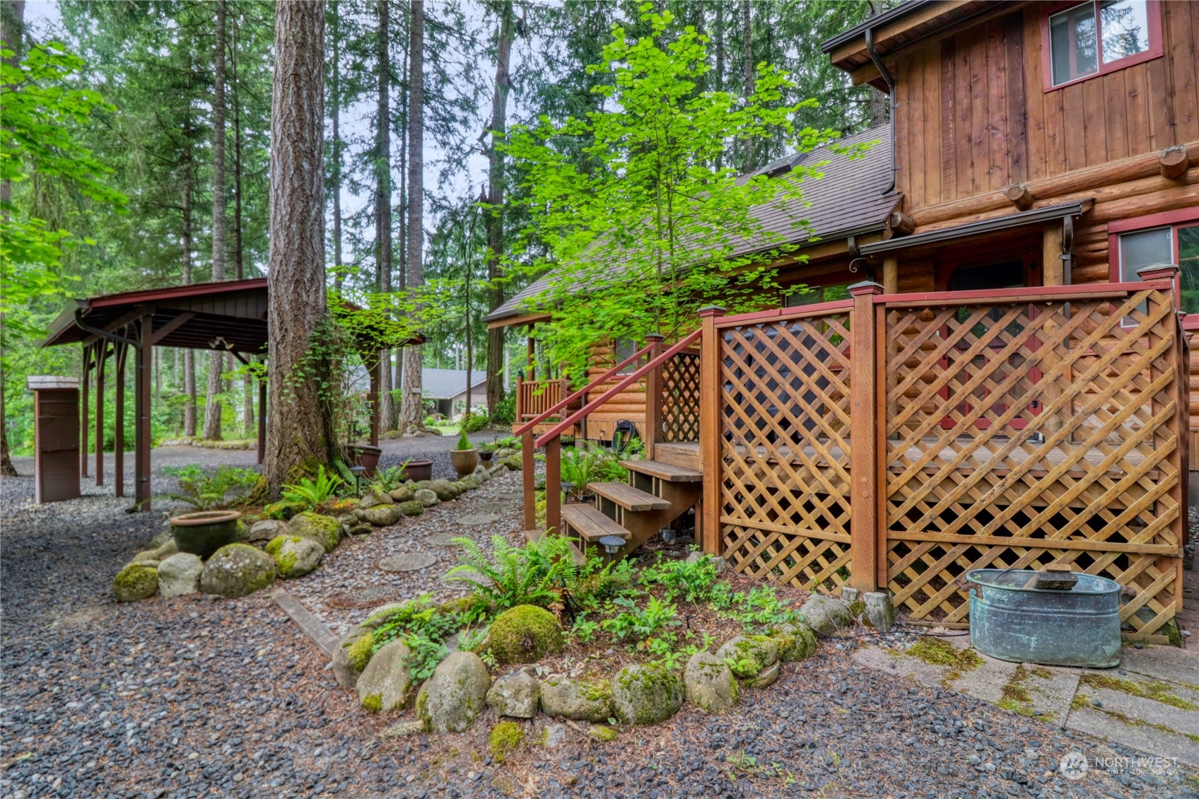 18114 Rampart Drive Southeast Yelm, WA 98597 - Photo 23 of 38 a backyard of a house with lots of green space