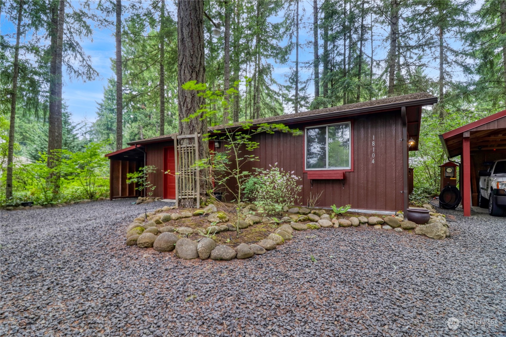 18114 Rampart Drive Southeast Yelm, WA 98597 - Photo 26 of 38 a front view of a house with garden