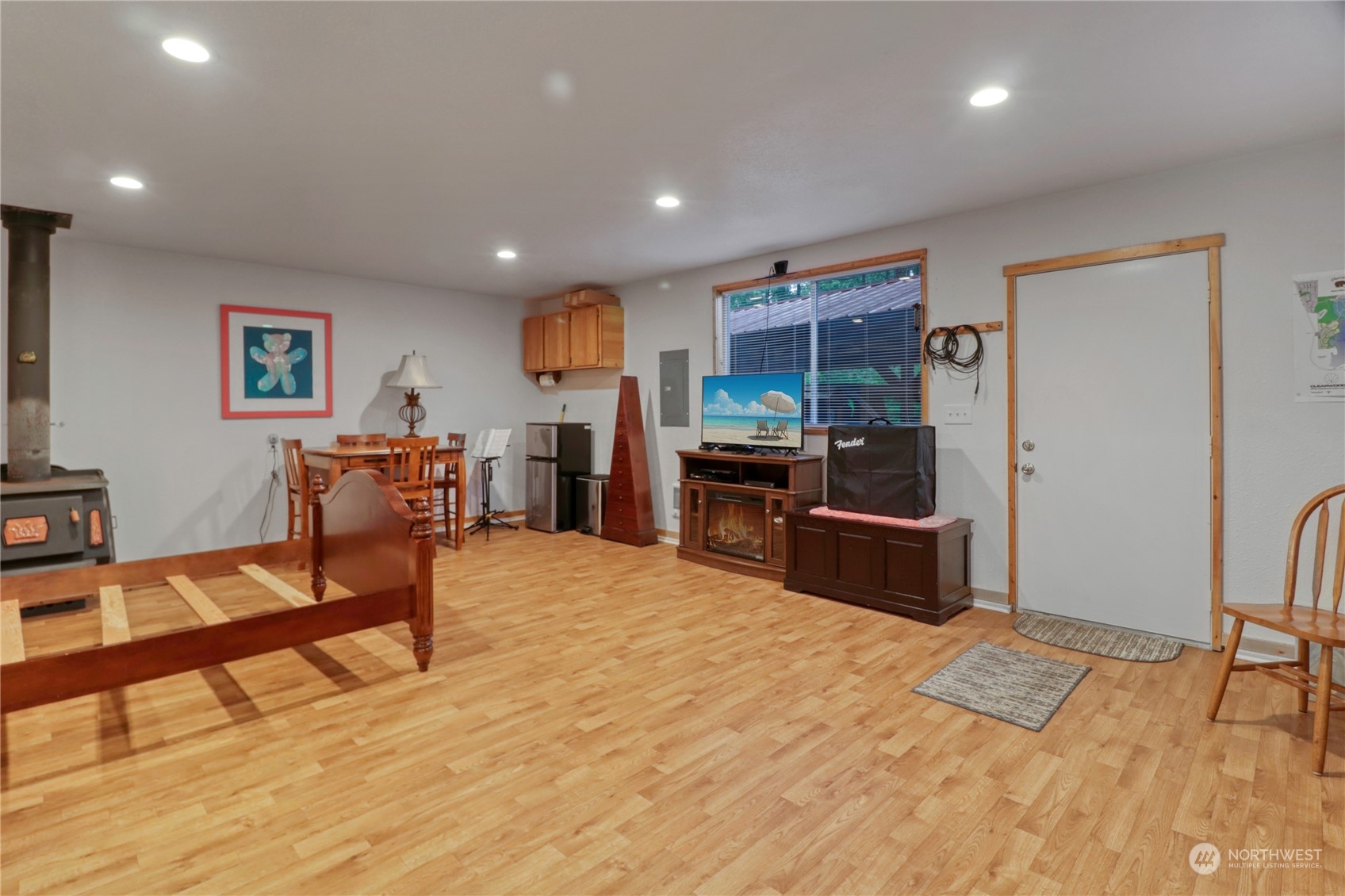 18114 Rampart Drive Southeast Yelm, WA 98597 - Photo 28 of 38 a living room with furniture and a wooden floor