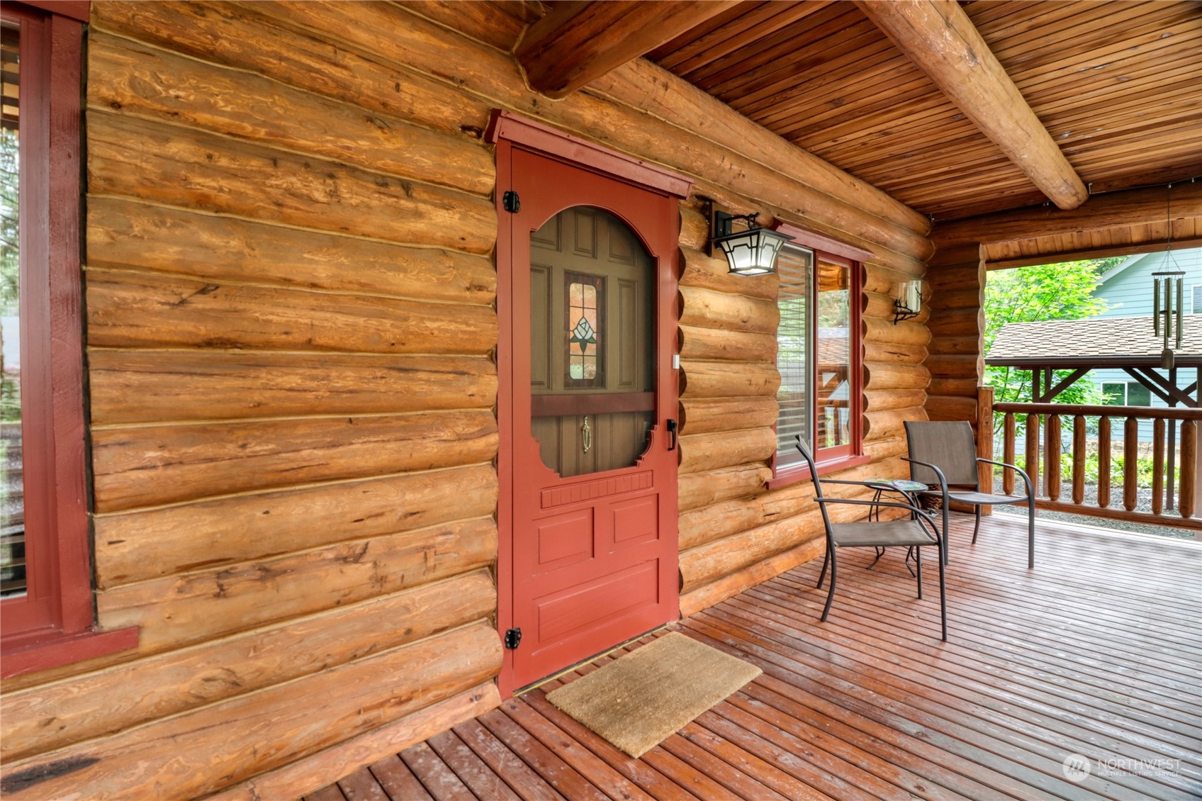 18114 Rampart Drive Southeast Yelm, WA 98597 - Photo 4 of 38 a view of a porch with wooden floor and outdoor seating