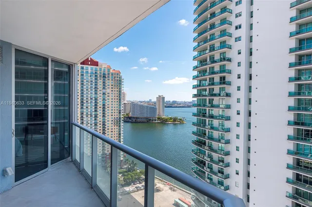 a view of balcony with outdoor space and lake view