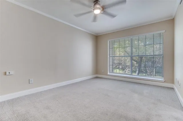 an empty room with a empty space and a window