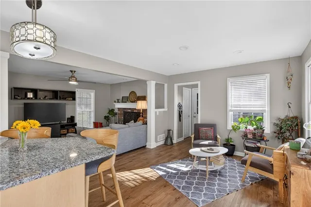 a living room with furniture a window and a table