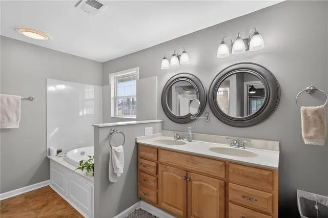 a bathroom with a sink a mirror and a toilet