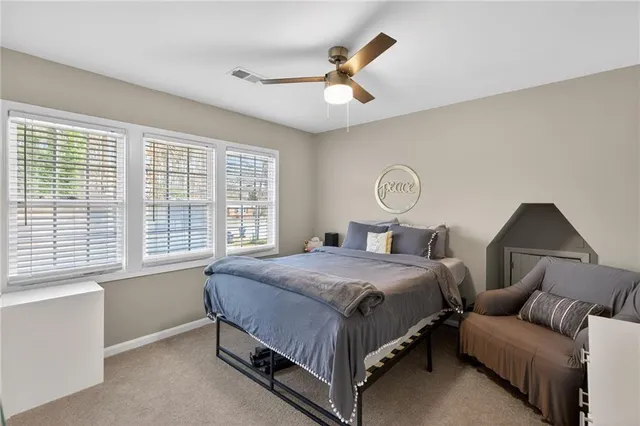 a bed room with a bed and a chandelier