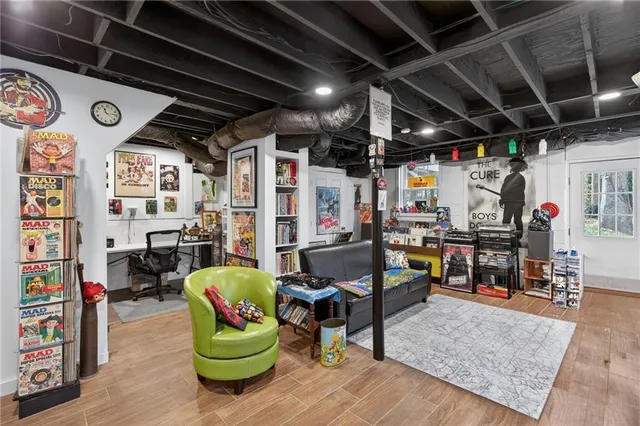 a view of living room with clothes and shoes