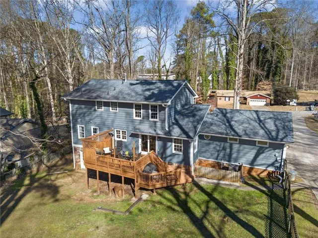 an outdoor sitting area with furniture