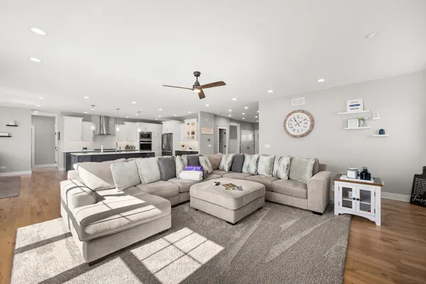 a living room with a fireplace and a flat screen tv
