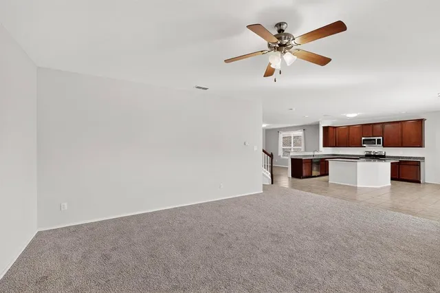 a view of kitchen with cabinets