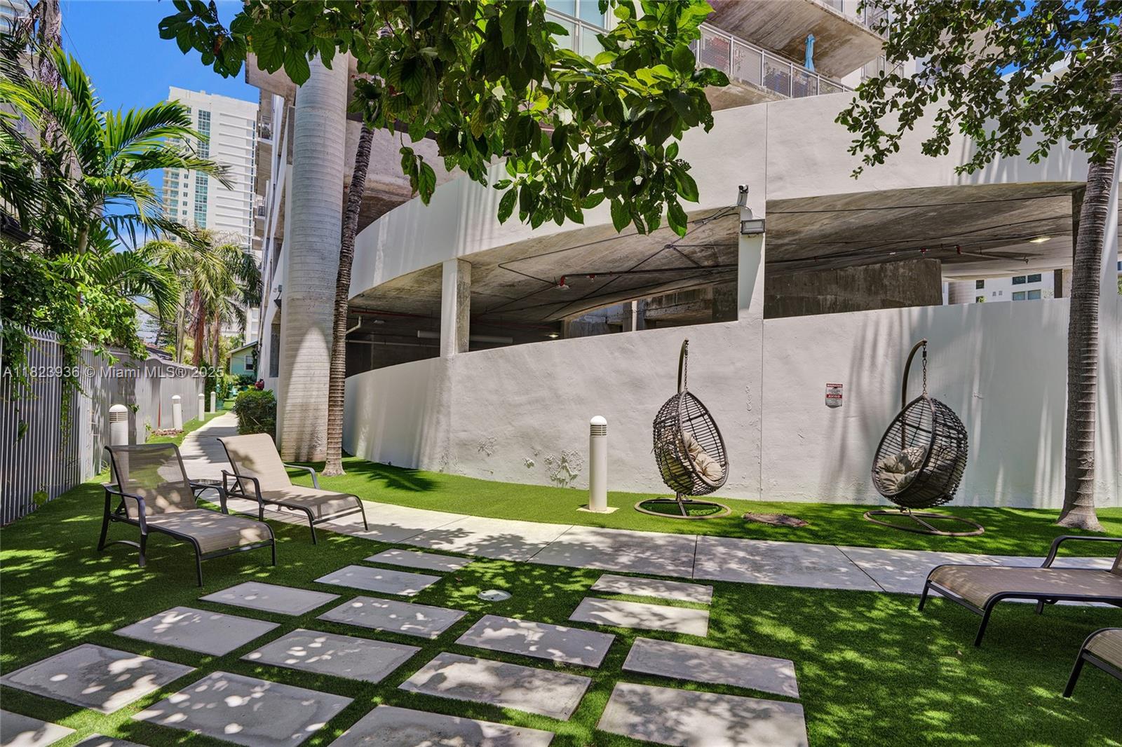 455 Northeast 25th Street, Unit 609 Miami, FL 33137 - Photo 24 of 27 a front view of a house with garden