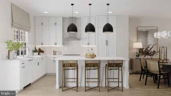 a kitchen with cabinets and chairs