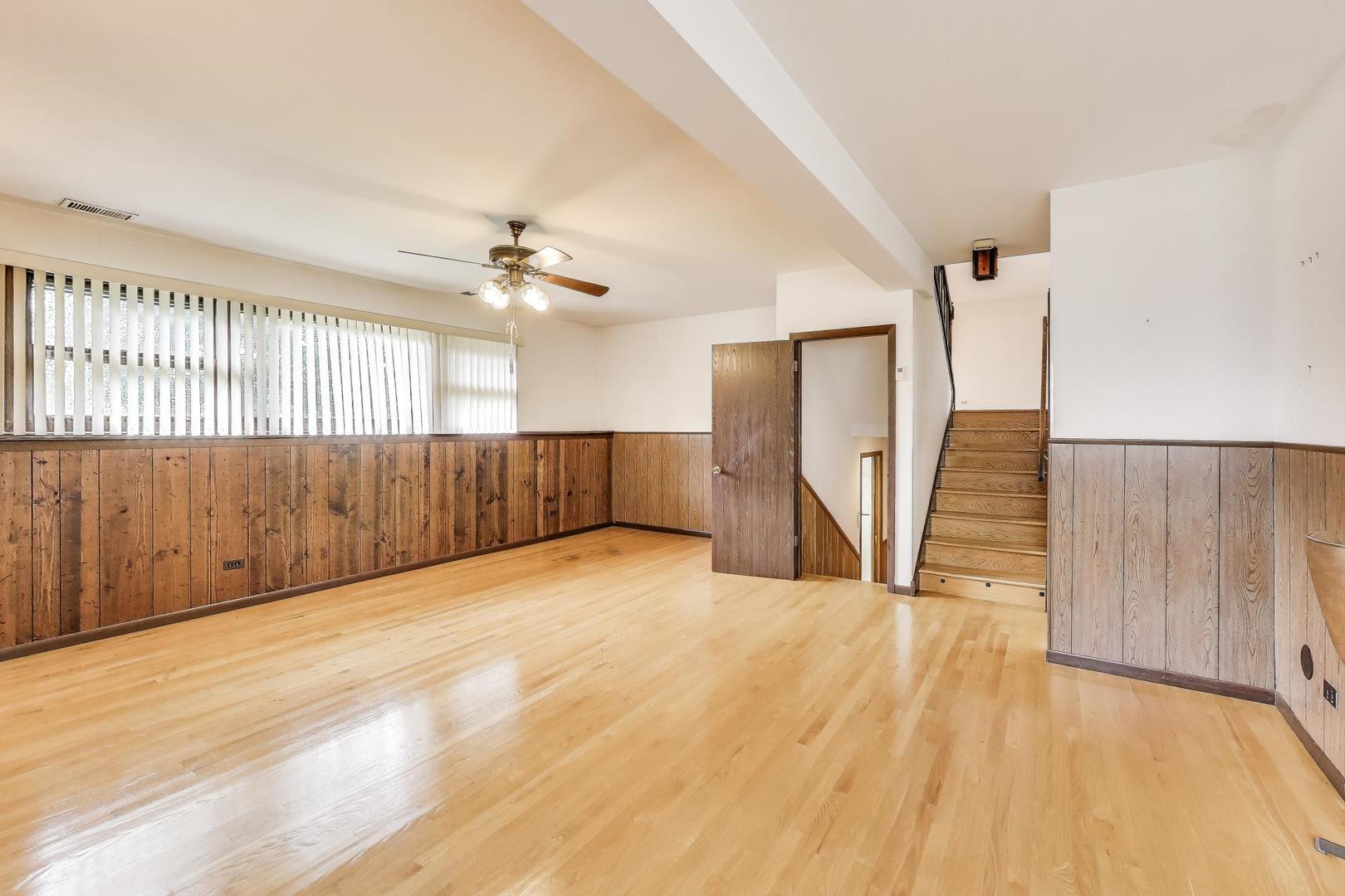 700 Noah Terrace Mount Prospect, IL 60056 - Photo 12 of 35 a view of an empty room with wooden floor