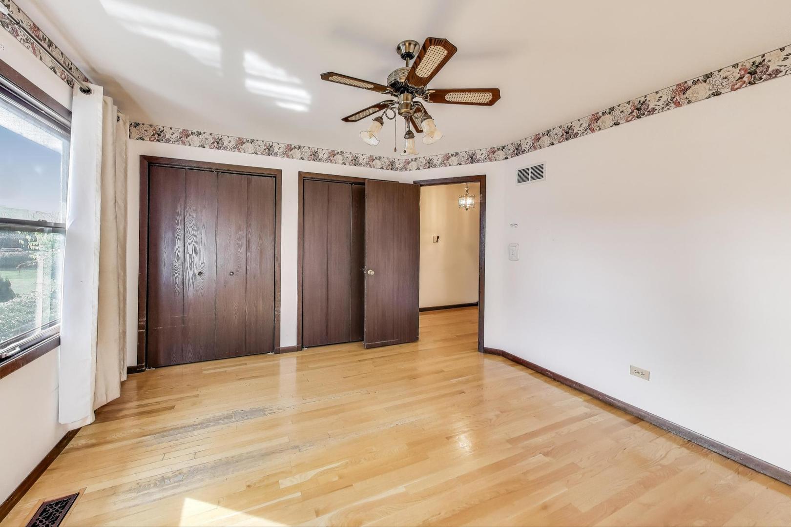 700 Noah Terrace Mount Prospect, IL 60056 - Photo 17 of 35 a view of a livingroom with a ceiling fan and window