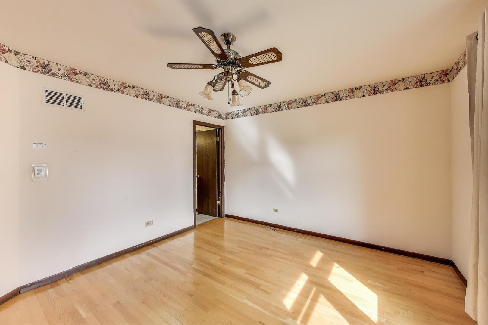 700 Noah Terrace Mount Prospect, IL 60056 - Photo 19 of 35 a view of a room with a window and a ceiling fan