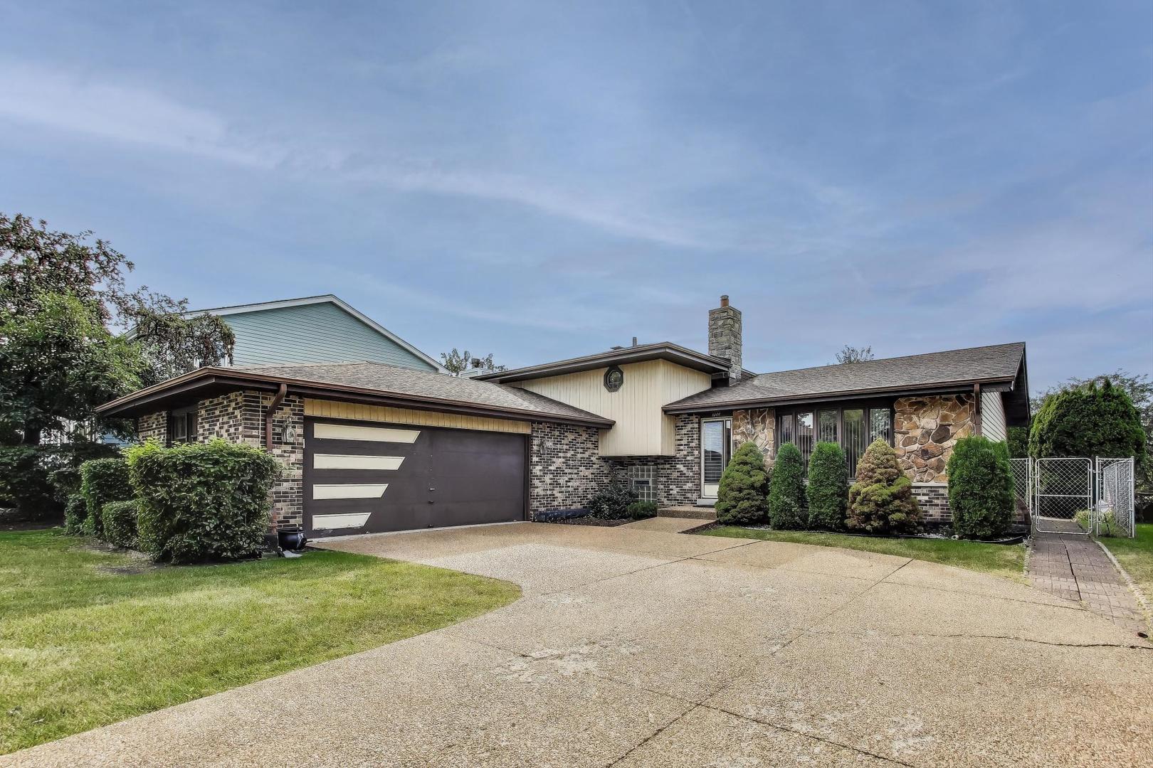 700 Noah Terrace Mount Prospect, IL 60056 - Photo 2 of 35 front view of a house with a yard
