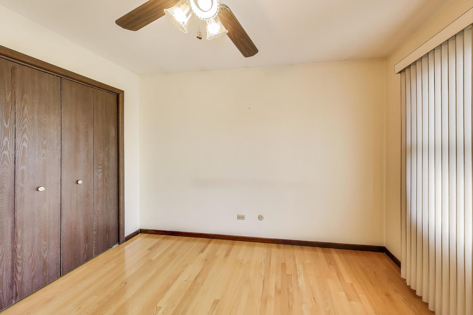 700 Noah Terrace Mount Prospect, IL 60056 - Photo 23 of 35 a view of a room with a wooden floor and white walls