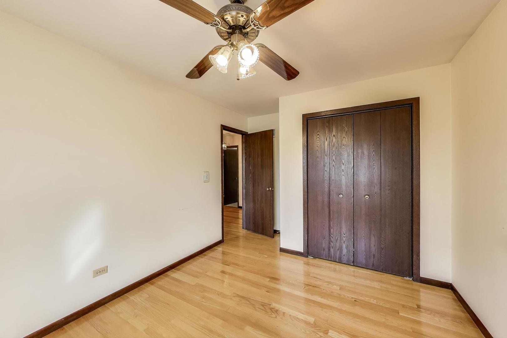 700 Noah Terrace Mount Prospect, IL 60056 - Photo 24 of 35 an empty room with closet and fan
