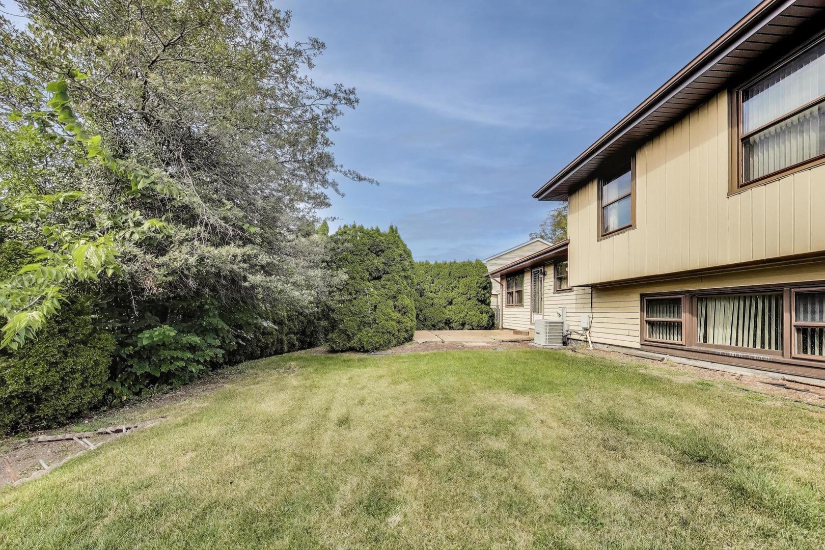 700 Noah Terrace Mount Prospect, IL 60056 - Photo 31 of 35 a view of a house with a yard and tree s