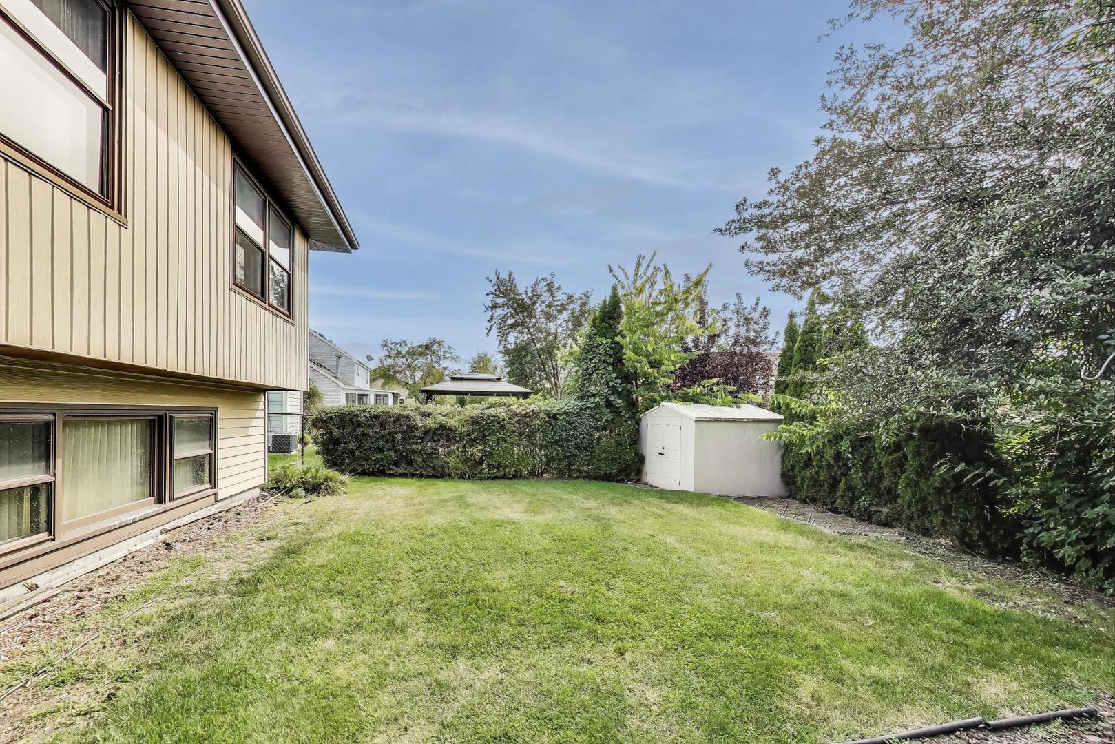 700 Noah Terrace Mount Prospect, IL 60056 - Photo 32 of 35 a view of a house with a yard and garage