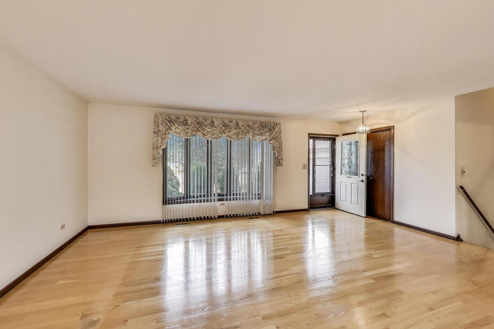 700 Noah Terrace Mount Prospect, IL 60056 - Photo 5 of 35 a view of an empty room with glass door